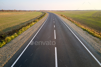Aerial check out of empty intercity highway at sunset. Best watch from drone of highway in night