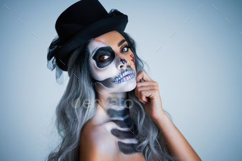 Spooky portrait of female in halloween gotic makeup