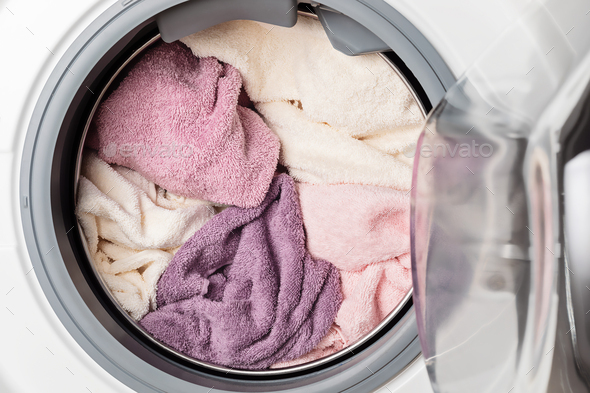 Washing or drying equipment loaded with the laundry. Washing, spring cleaning idea