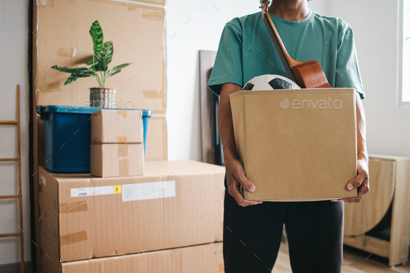 Close-up Hands Holds Box of Goods During Moving House
